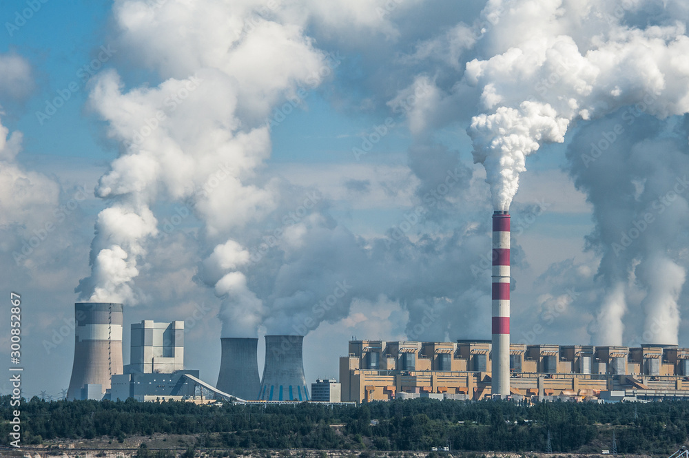 Power plant Bełchatów, Poland. Coal-fired power station with steam billowing from high chimneys Stock Photo | Adobe Stock