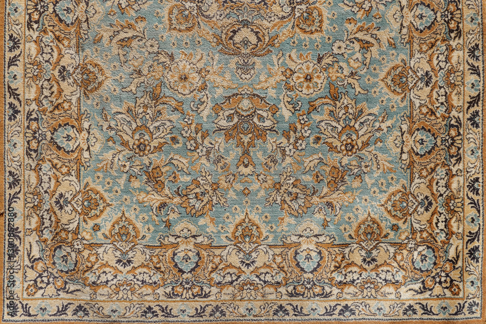 background of antique old oriental carpet, close up