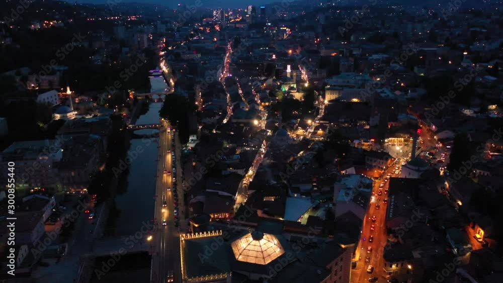 SARAJEVO, BOSNIA AND HERZEGOVINA, AUGUST 11 2019: Aerial/drone shot of Sarajevo City Hall taken during sunset. Most famous building in Sarajevo. Vijecnica SARAJEVO, BOSNIA AND HERZEGOVINA, AUGUST 11 2019: Aerial/drone shot of Sarajevo City Hall taken during sunset. Most famous building in Sarajevo. Vijecnica