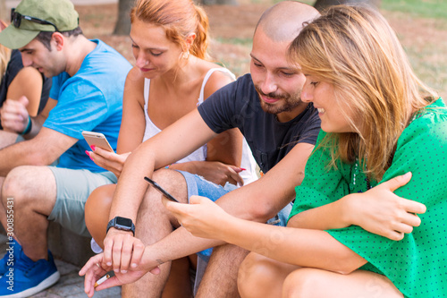 Group of friends watching smart mobile phones - Millennials 