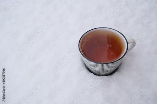 Winter tea. A cup of tea in the snow.copy space.
