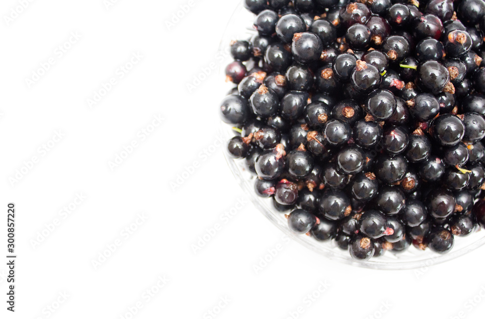 Black currant on a plate. Background. Photo. Black currant on a plate. Background. Photo.