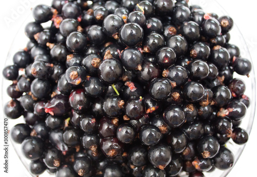 Black currant on a plate. Background. Photo.