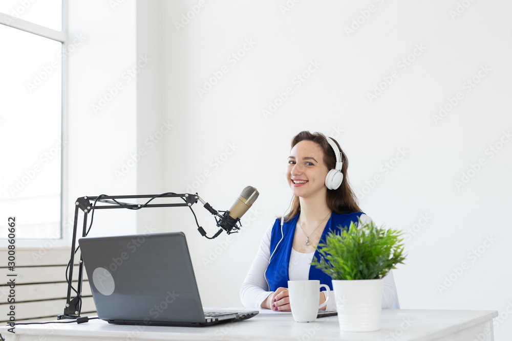 Radio host concept - Portrait of woman radio presenter with headphones Radio host concept - Portrait of woman radio presenter with headphones