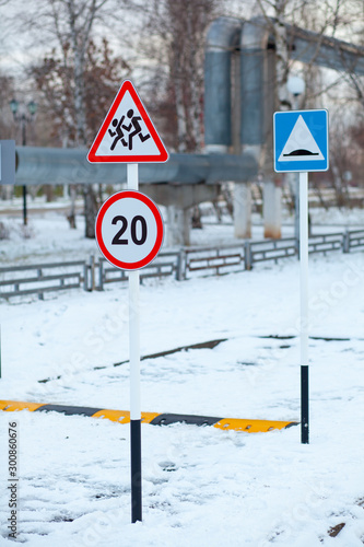caution sign children on the Playground in winter