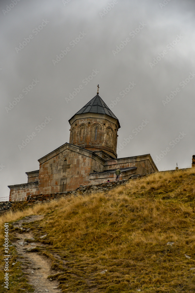 Gergeti Trinity Church on the top of mountains, near Village of Kazbegi, the one the nice tourist spot, historical and nature, October 19, 2019, Kazbegi, Republic of Gerogia