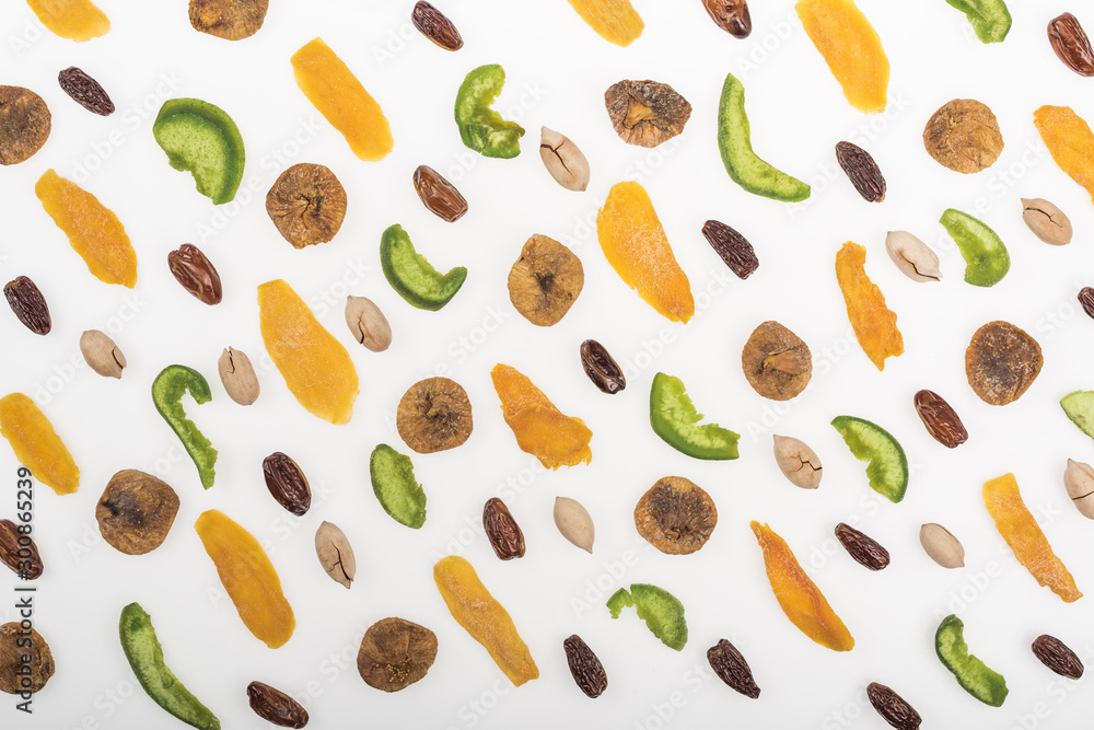 top view of assorted nuts, dried fruits and candied fruit isolated on white top view of assorted nuts, dried fruits and candied fruit isolated on white