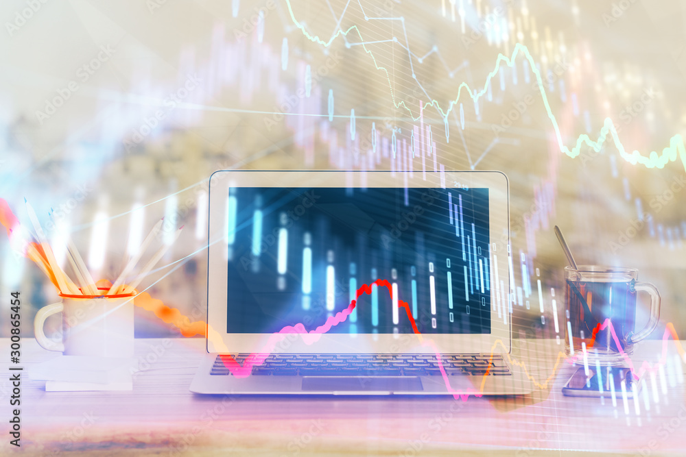 Forex Chart hologram on table with computer background. Multi exposure. Concept of financial markets.