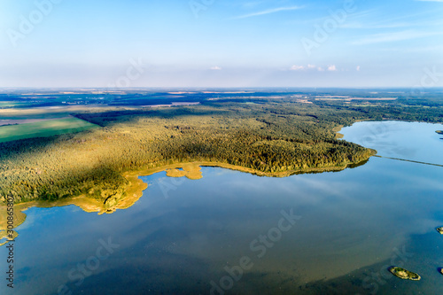 Beautiful aerial shot of a large forest lake.