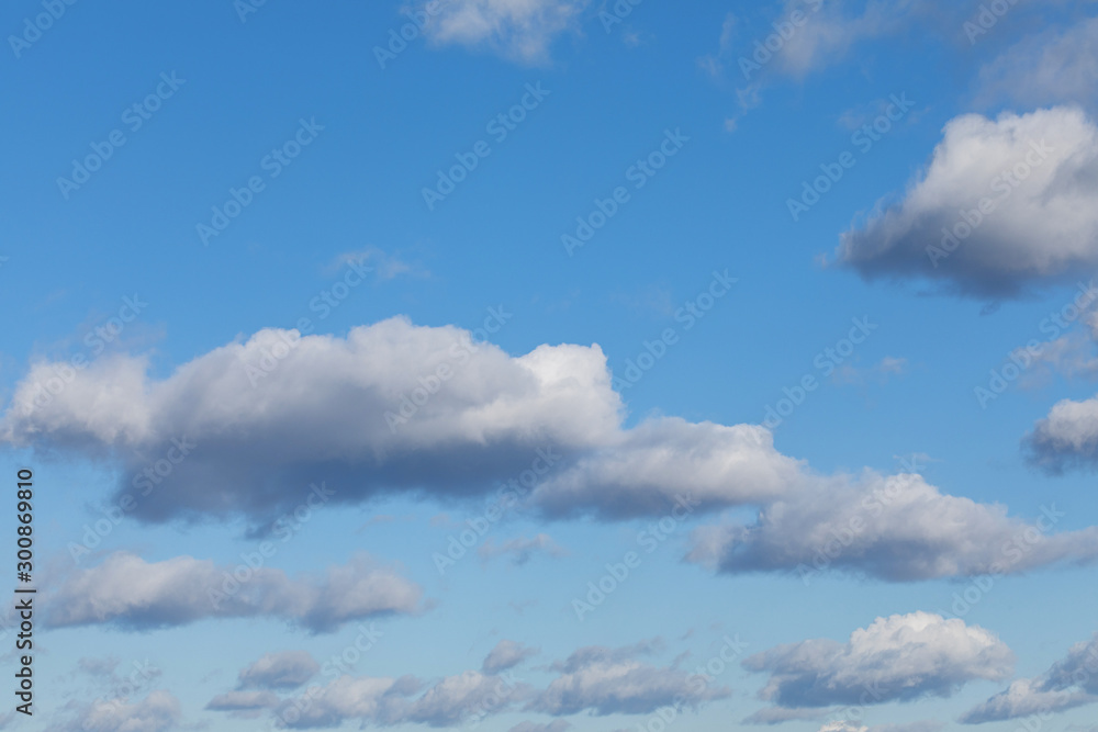 Naklejka premium Heavenly bright blue sky with white, fluffy could. Background from clouds.