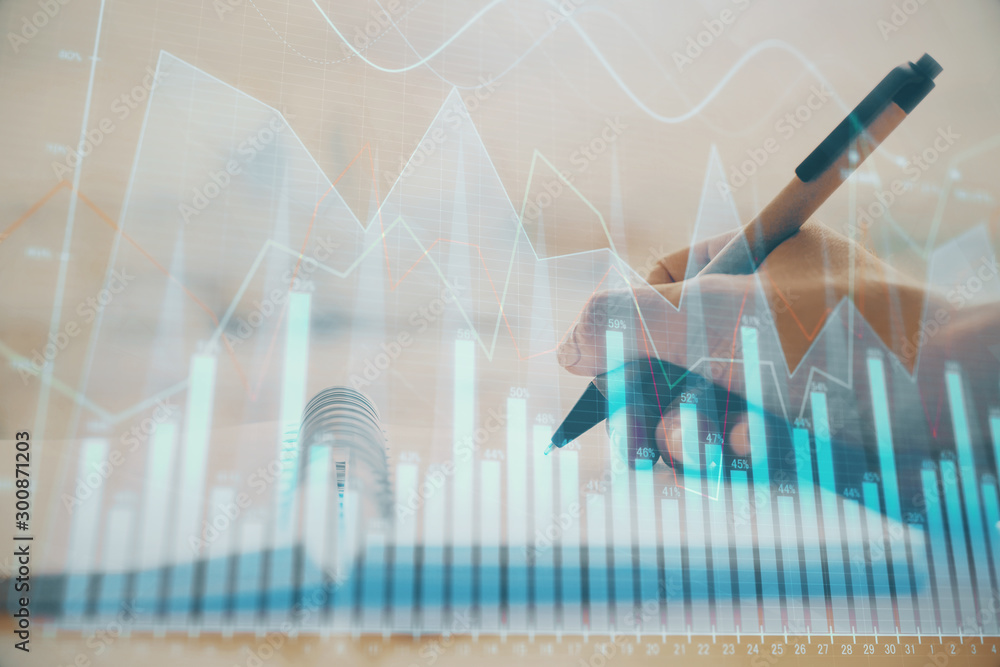 Forex graph on hand taking notes background. Concept of research. Multi exposure Forex graph on hand taking notes background. Concept of research. Multi exposure