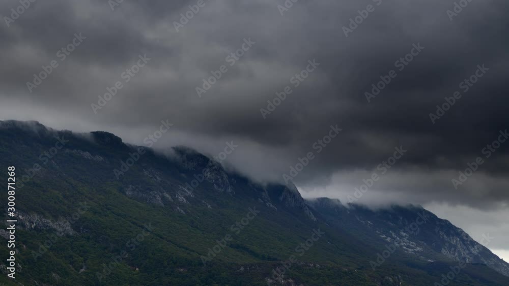 Timelapse of stormy clouds over mountain peak Timelapse of stormy clouds over mountain peak