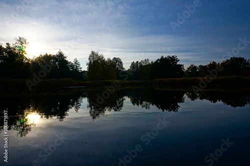 beautiful lakeside with trees and refelctions in autumn