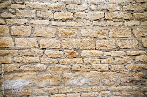 Background of an ancient wall made of natural stone.