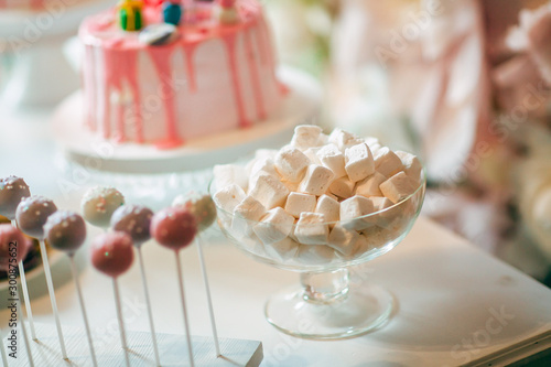 Peppa pig decorated themed cake.Table with sweets photo