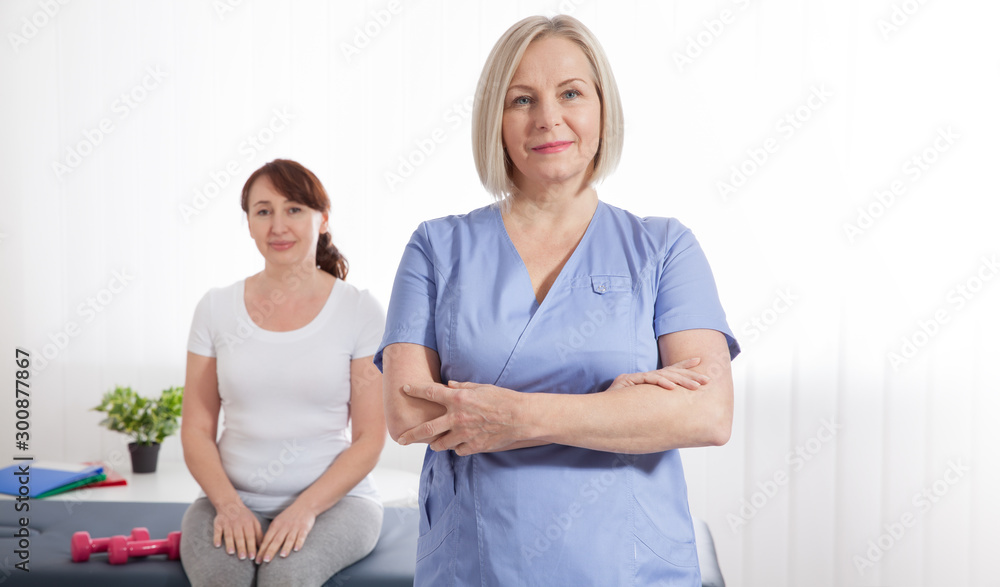 Female patient being reassured by doctor in hospital. Health recovery concept Female patient being reassured by doctor in hospital. Health recovery concept