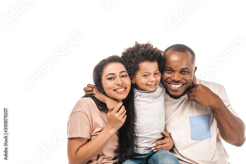 happy african american boy hugging parents and smiling at camera isolated on white © LIGHTFIELD STUDIOS