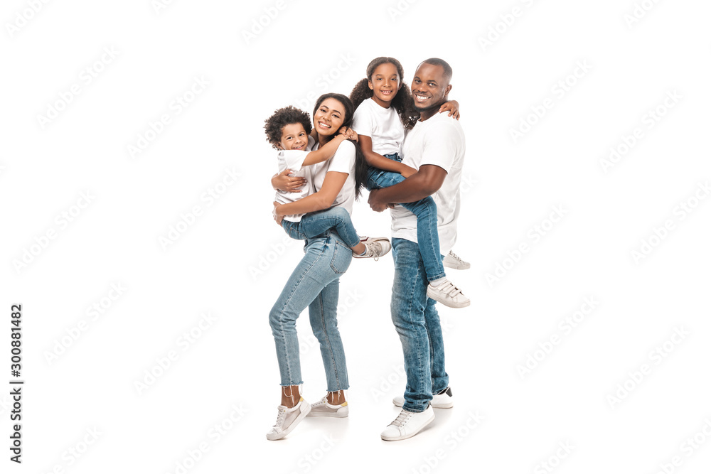 happy african american woman holding son, and husband holding daughter on white background happy african american woman holding son, and husband holding daughter on white background