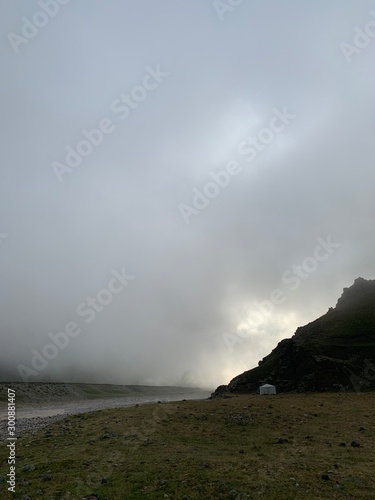 mountain landscape with fluffy clouds