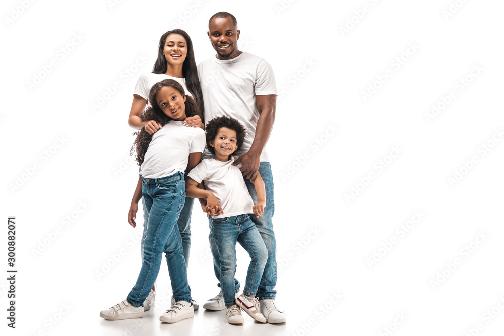 happy african american parents with daughter and son smiling at camera while standing on white background