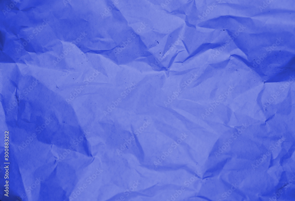 Blue crumpled paper texture background.