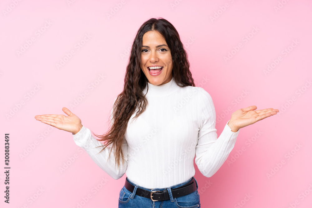 Young woman over isolated pink background with shocked facial expression Young woman over isolated pink background with shocked facial expression