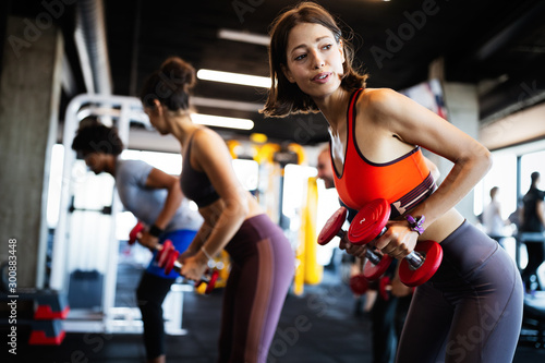 Beautiful fit women working out in gym