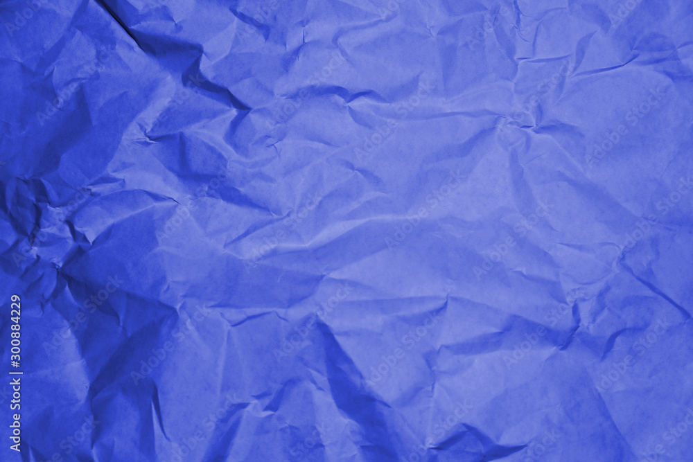 Fototapeta premium Blue crumpled paper texture background.