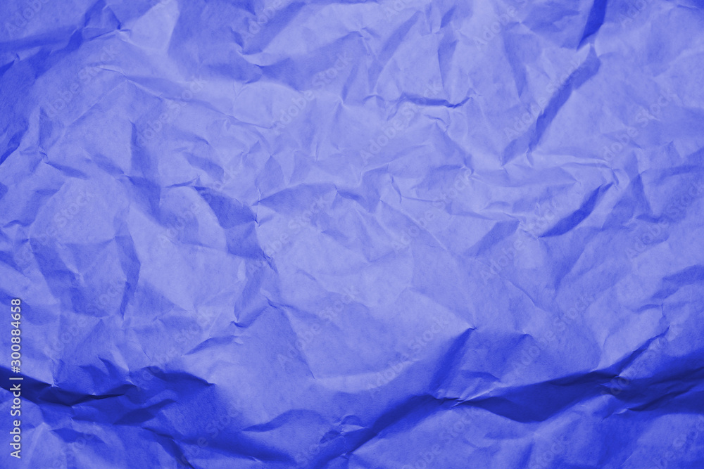 Blue crumpled paper texture background.