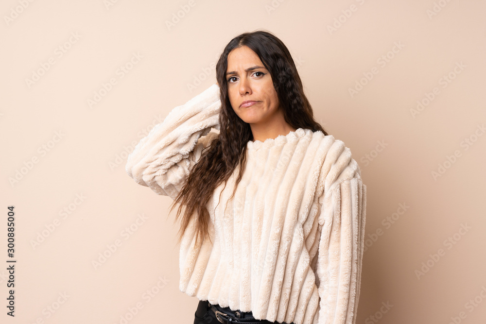 Young woman over isolated background having doubts Young woman over isolated background having doubts