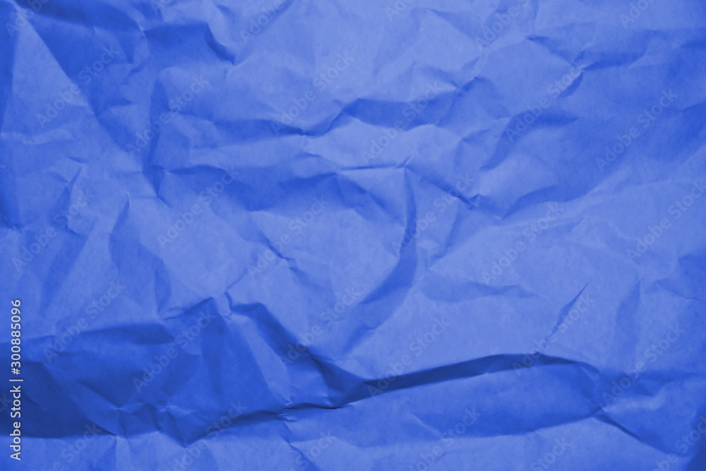 Fototapeta premium Blue crumpled paper texture background.