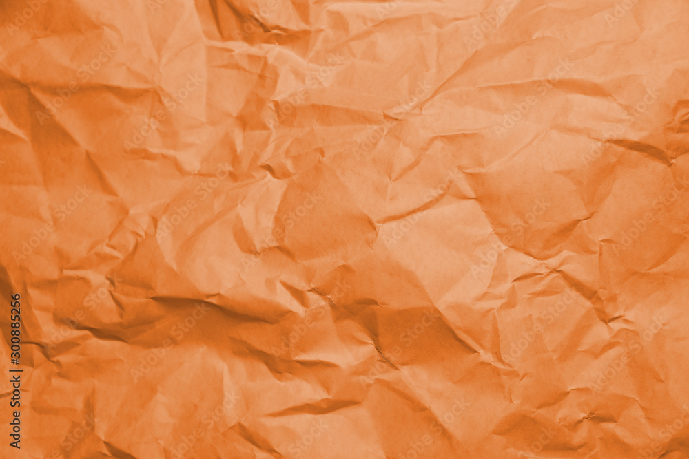 Fototapeta premium Orange texture of crumpled paper.