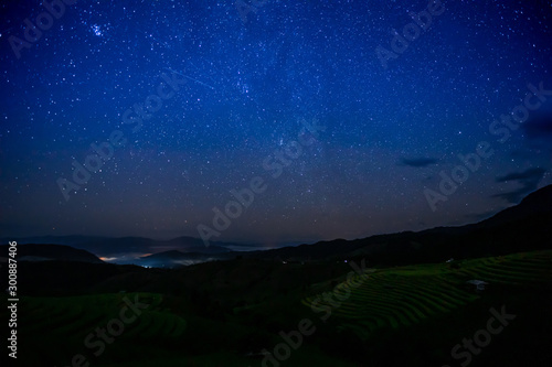 The terraced golden rice field with stars and mountain in the night at Ban Pa Pong Piang village in Mae Chaem, Chiang Mai province, Thailand.. © chirawan_nt