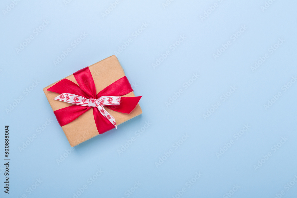 Christmas gift box on blue background. Top view with copy space - Image Christmas gift box on blue background. Top view with copy space - Image