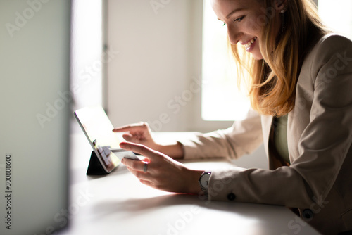 Smiling Woman Paying with Cedit Card Online 