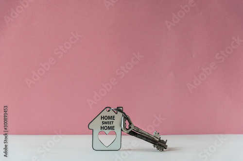 Key and house shape with text home sweet home