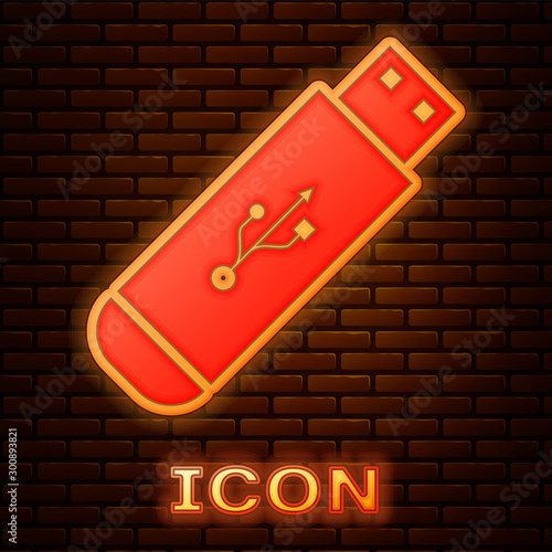 Glowing neon USB flash drive icon isolated on brick wall background. Vector Illustration