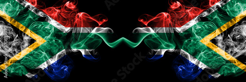 South Africa vs South Africa, African smoky mystic flags placed side by side. Thick colored silky abstract smoke flags concept