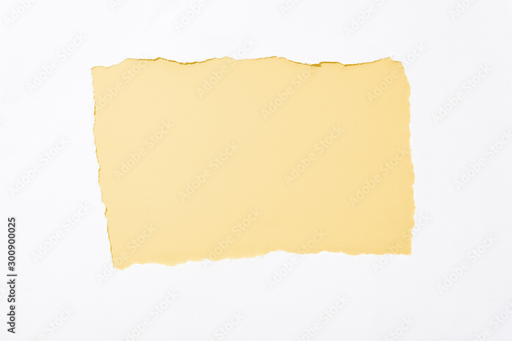 light yellow colorful background in white torn paper hole