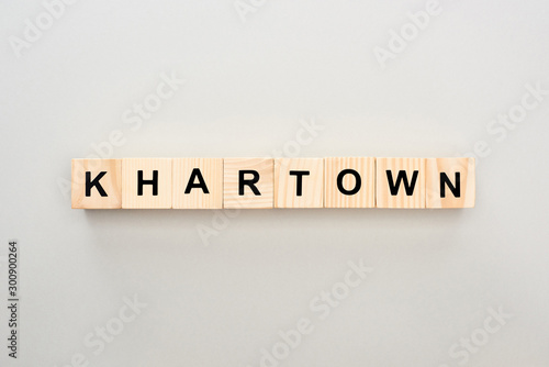 top view of wooden blocks with Khartown lettering on grey background