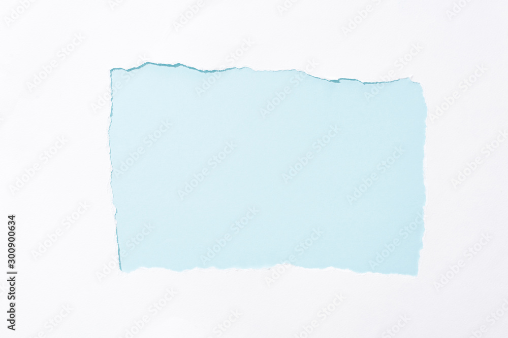 light blue colorful background in white torn paper hole