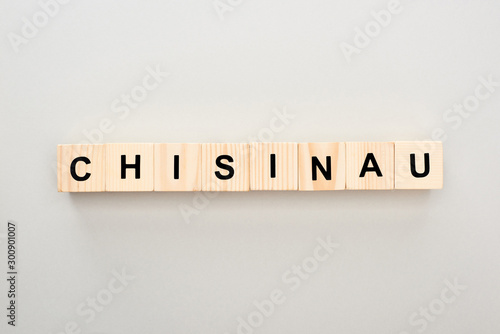 top view of wooden blocks with Chisinau lettering on grey background