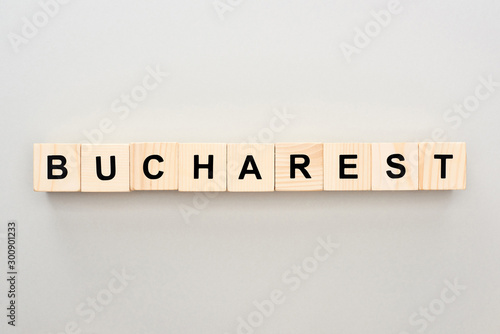 top view of wooden blocks with Bucharest lettering on grey background