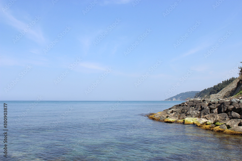 Blue clear sea, cliff and blue sky landscape