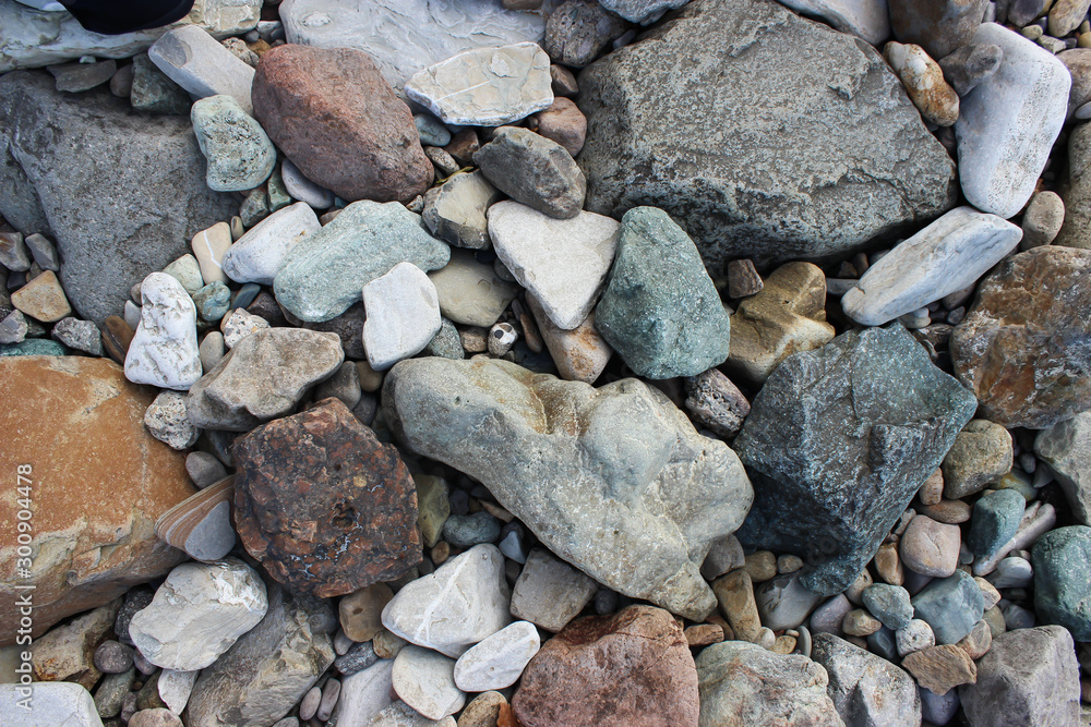 Pebbles in different colors on the beach Pebbles in different colors on the beach