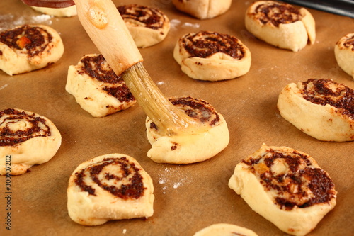 Brushing with egg glaze. Making Poppy Seed Snail. Sweet Roll Bun.