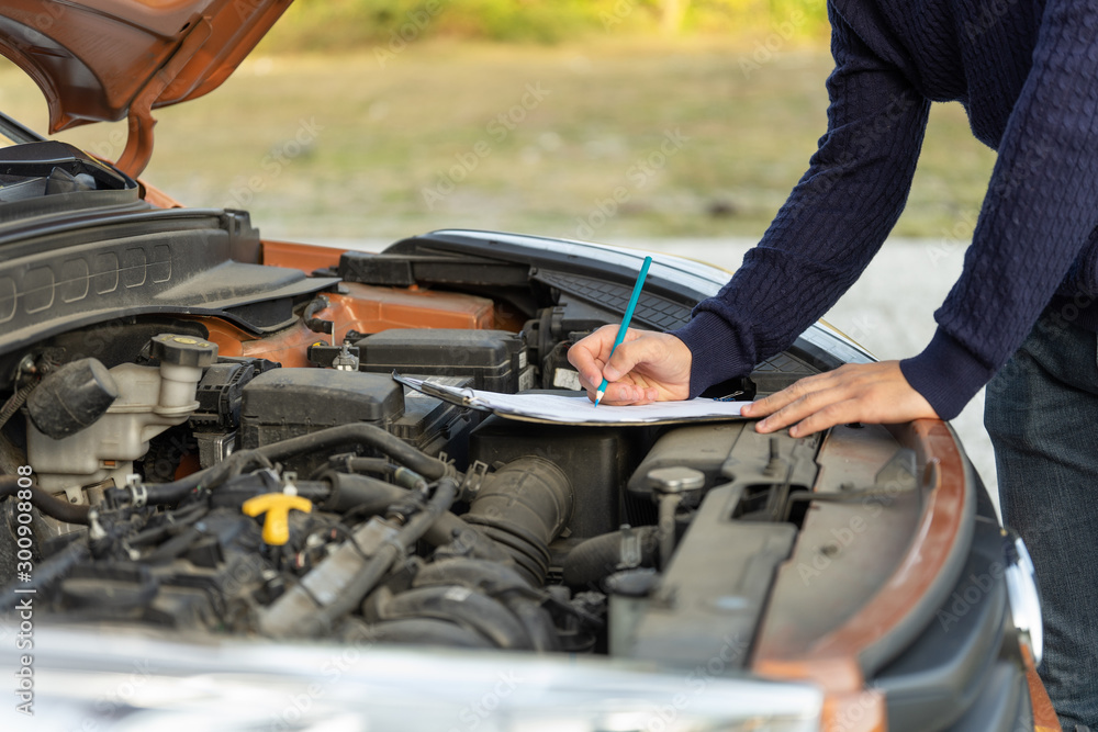 custom made wallpaper toronto digitalAuto car repair service center on the road. A mechanic checking car breaks.