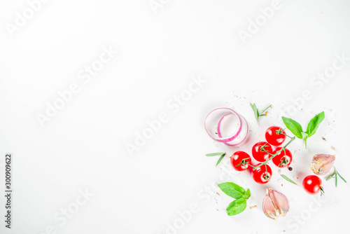 Flatlay with greens  herbs and spices on white background. Frame design food pattern for restoration Menu  background with fresh cooking ingredients  overhead top view  copy space