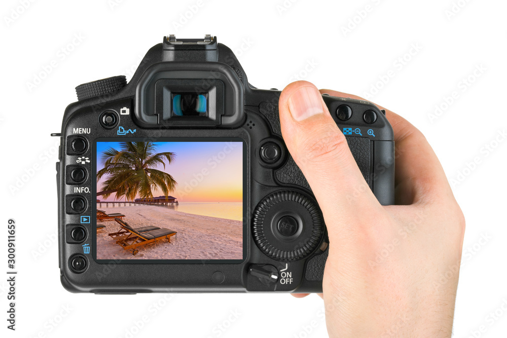 Hand with camera and Maldives beach photo (my photo) Hand with camera and Maldives beach photo (my photo)