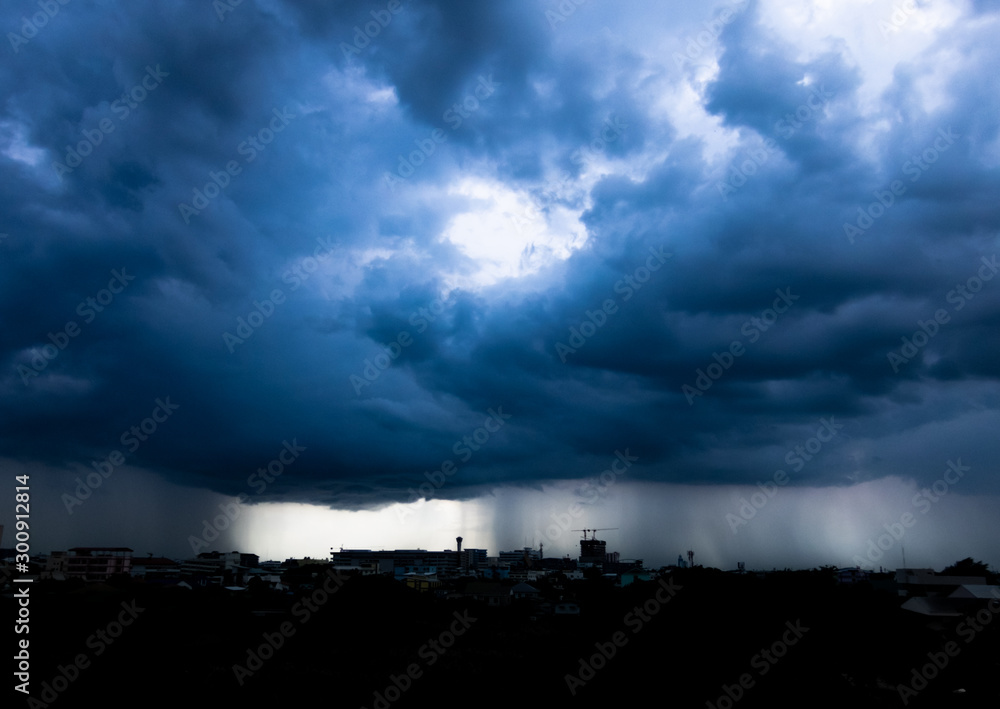 Storm cloud with heavy rain, lightning over city